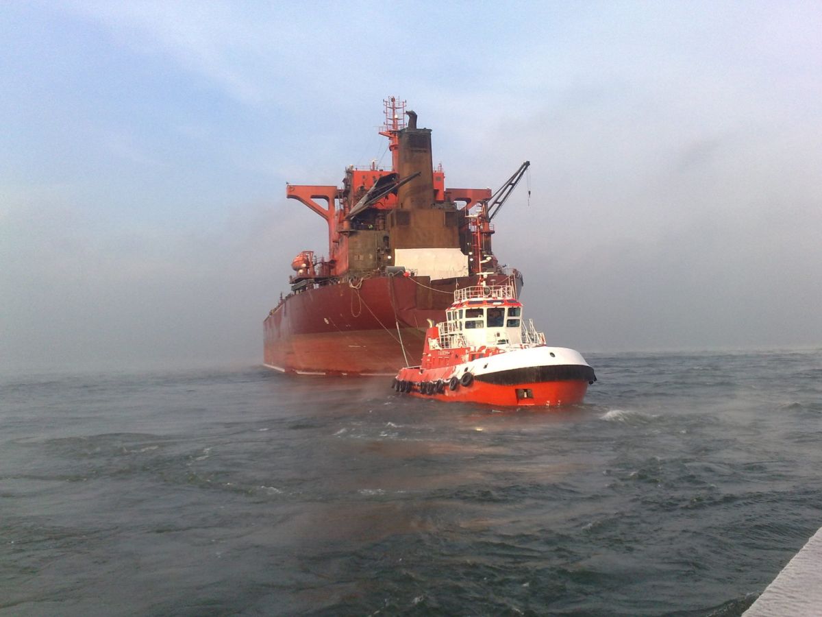 Tug assisting a vessel during towing