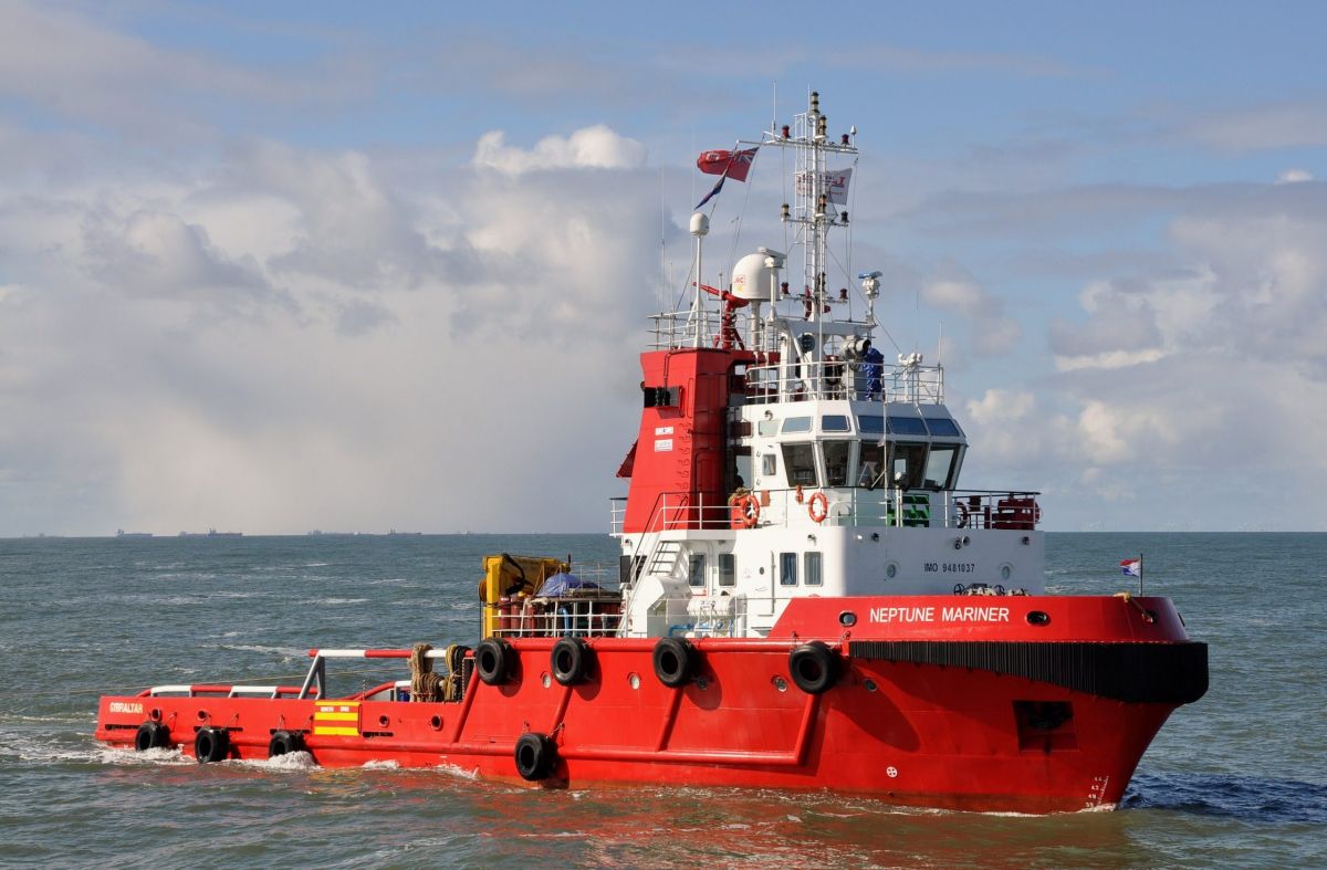Red sea-going tug on open water
